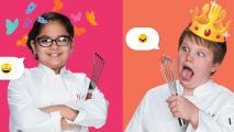 A close-up of a young boy and girl wearing white coats, holding cooking utensils in front of an orange and yellow background,